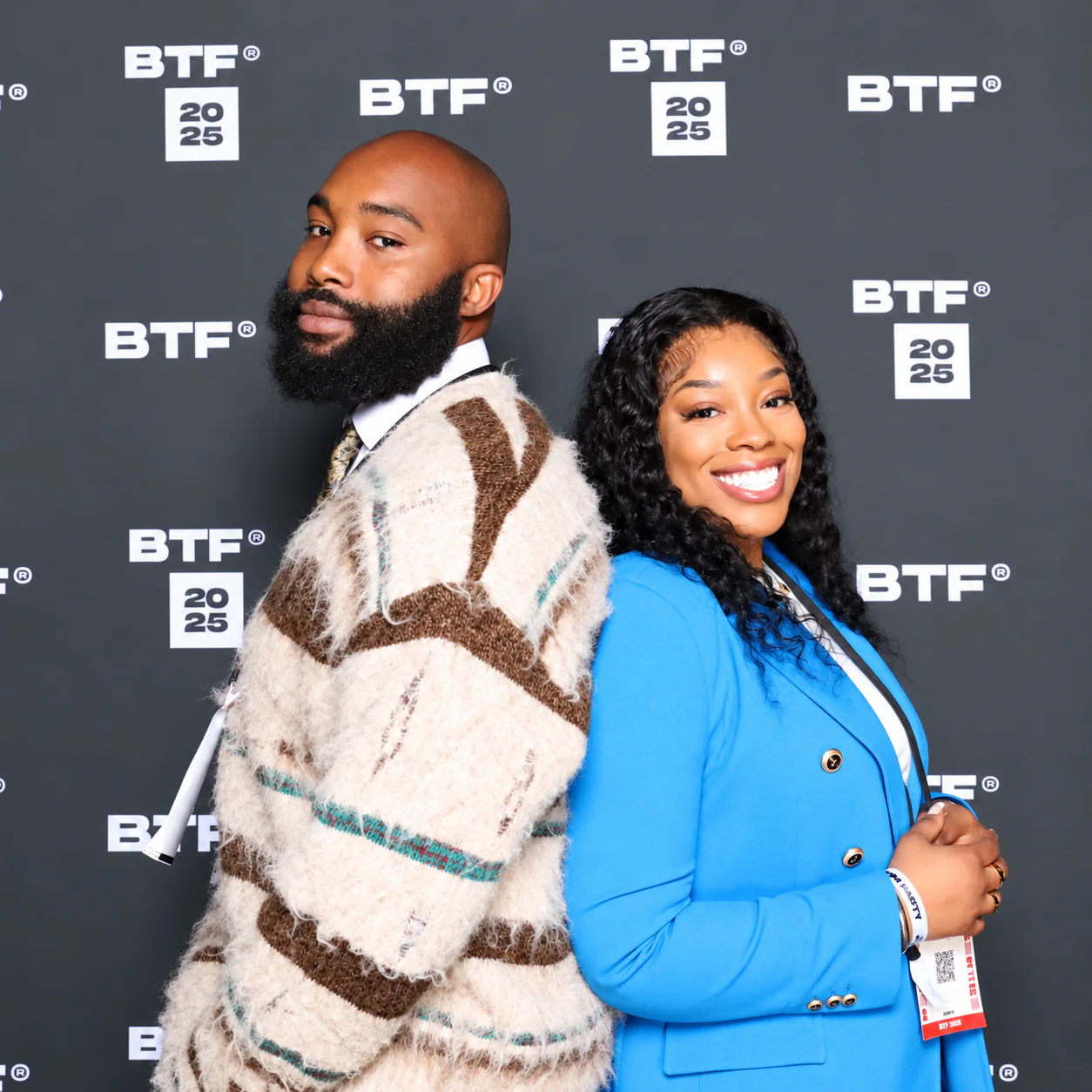 Two guests posing at a branded BTF corporate photo booth event in London