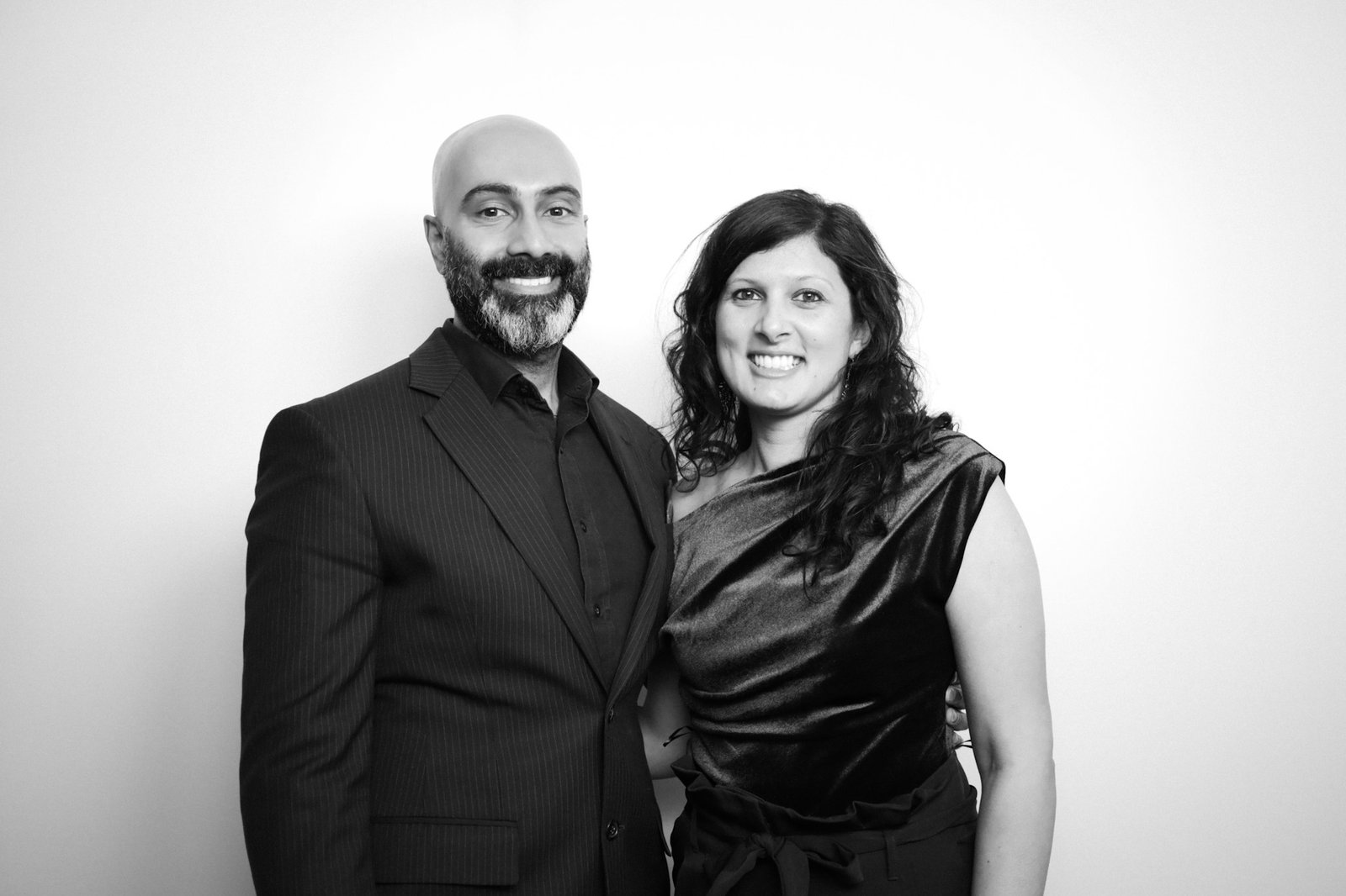Two guests photographed in a polished black-and-white Glam Booth portrait