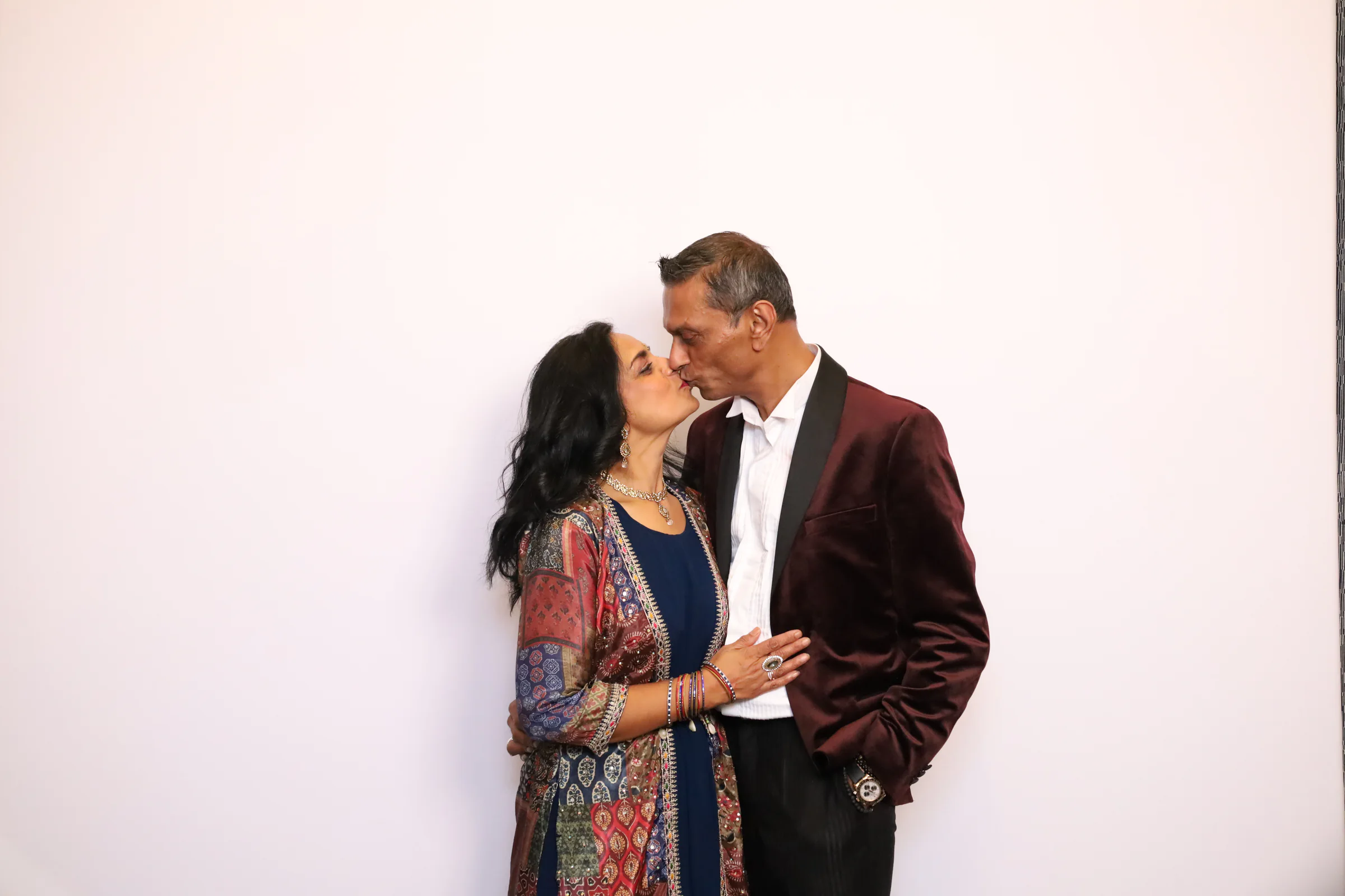 A couple sharing a celebratory moment during a private event photo experience